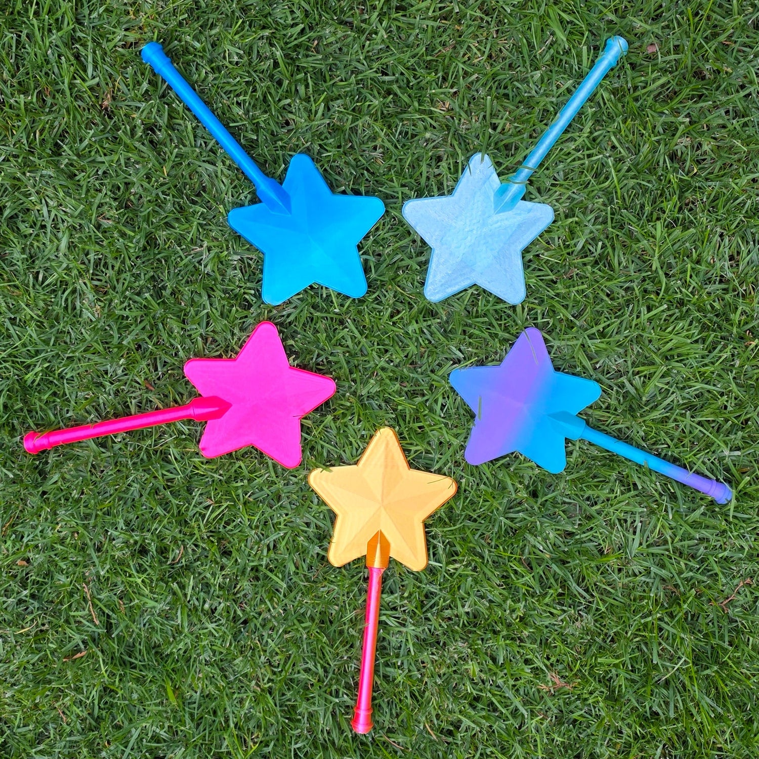 Colorful star-shaped toys on grass